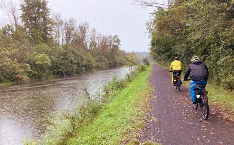 Cook men biking along the Erie Canal