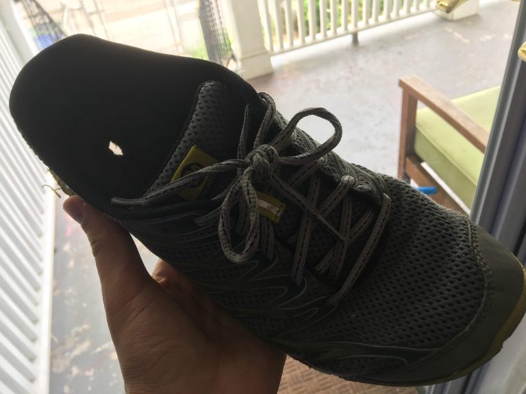 Running shoe with a hole in the sole